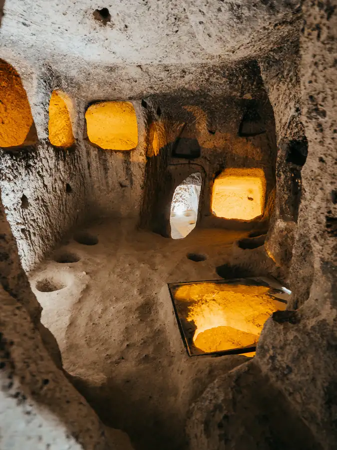 Kaymakli inside room with light and shelves