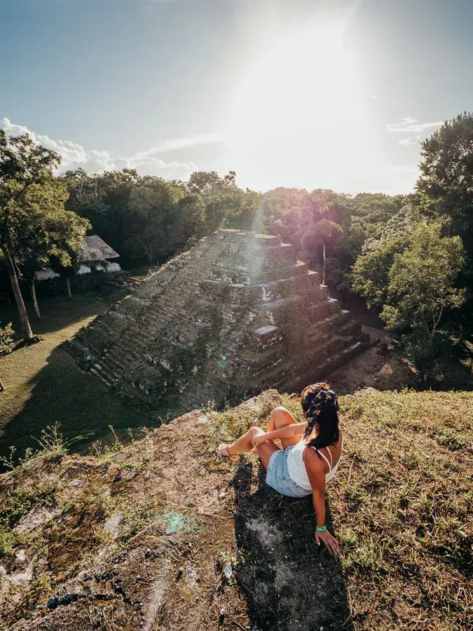 Flores Guatemala itinerary in yaxha watching sunset from temple