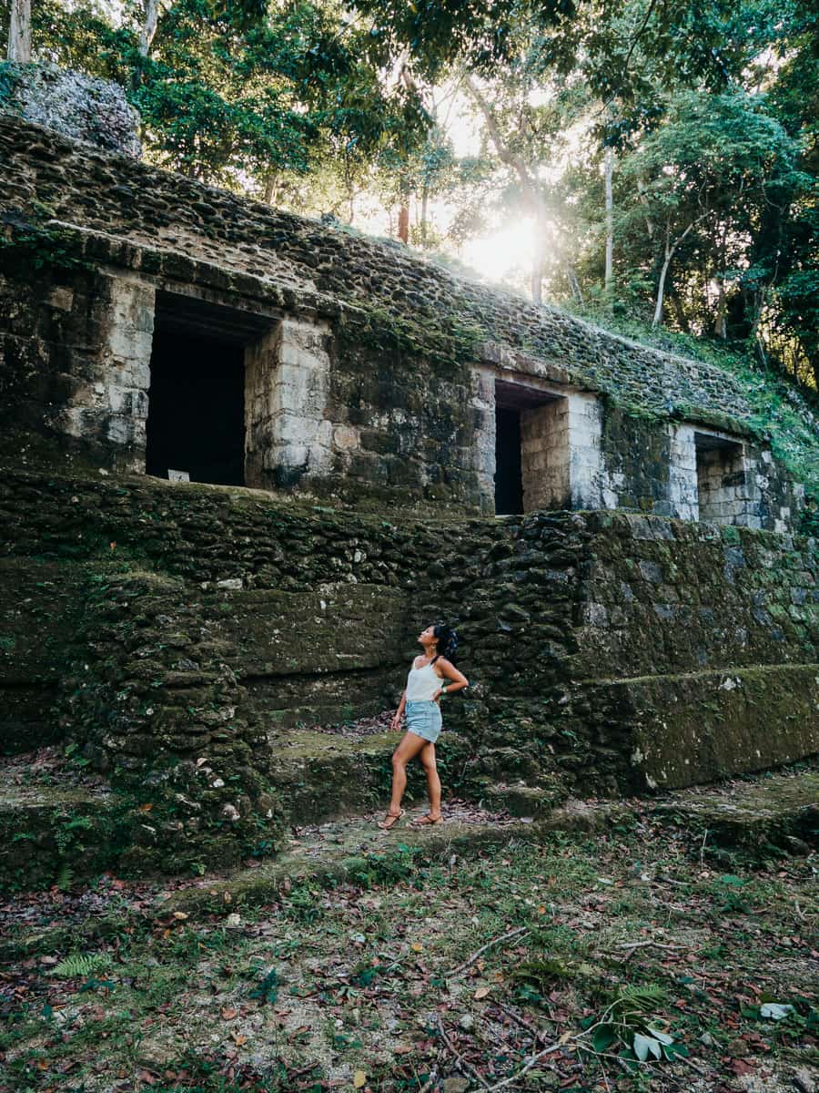 Standing in front of small temple in tikal