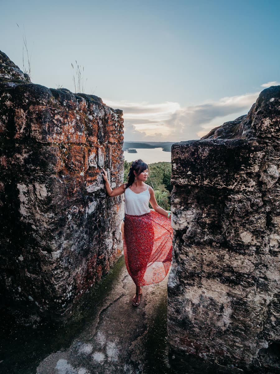 Watching sunset at the top of Yaxha temple, one of the best things to do in Flores Guatemala itinerary