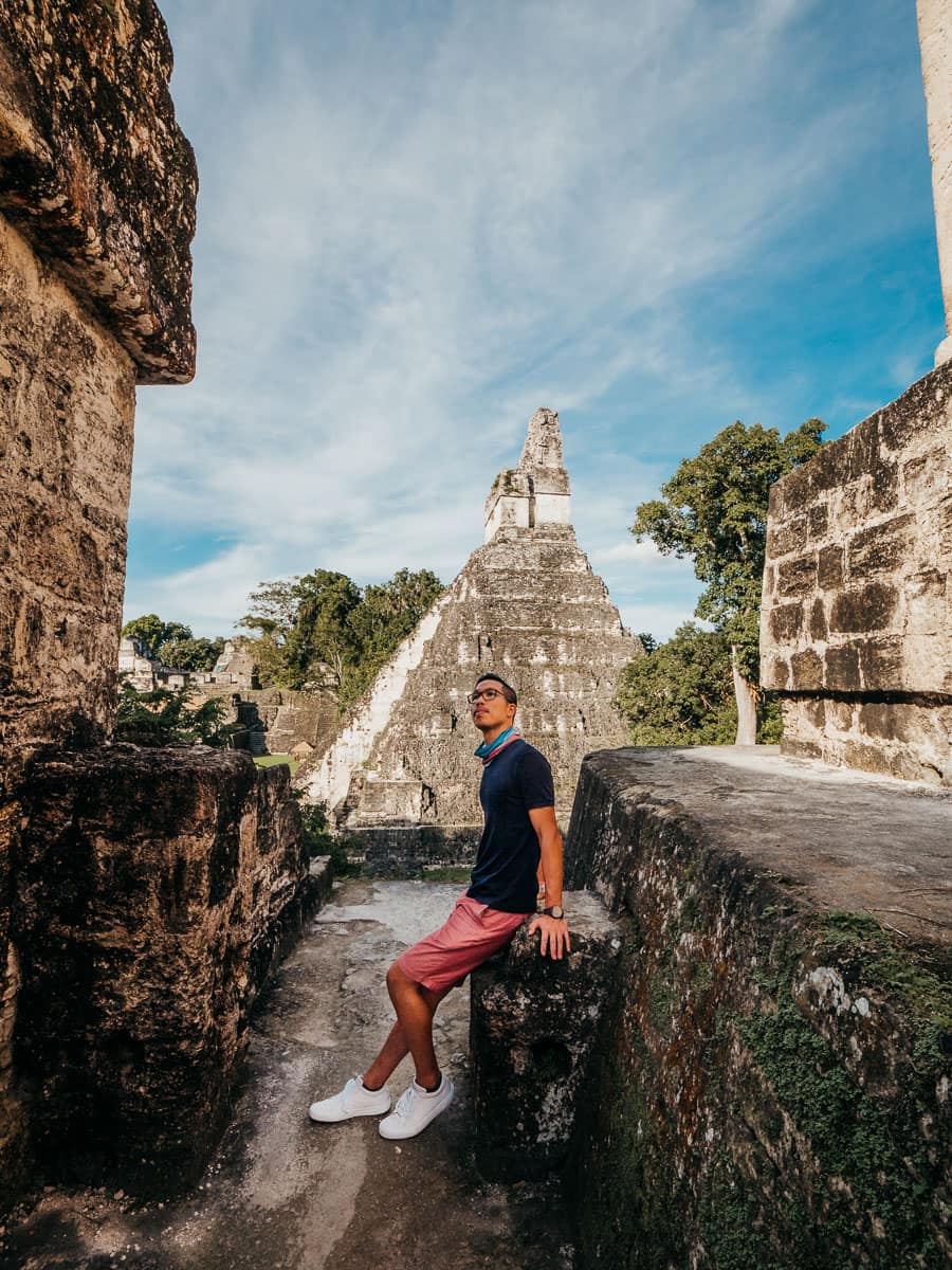 Standing in front of the main temple in Tikal, one of the best things to do in your Flores Guatemala itinerary