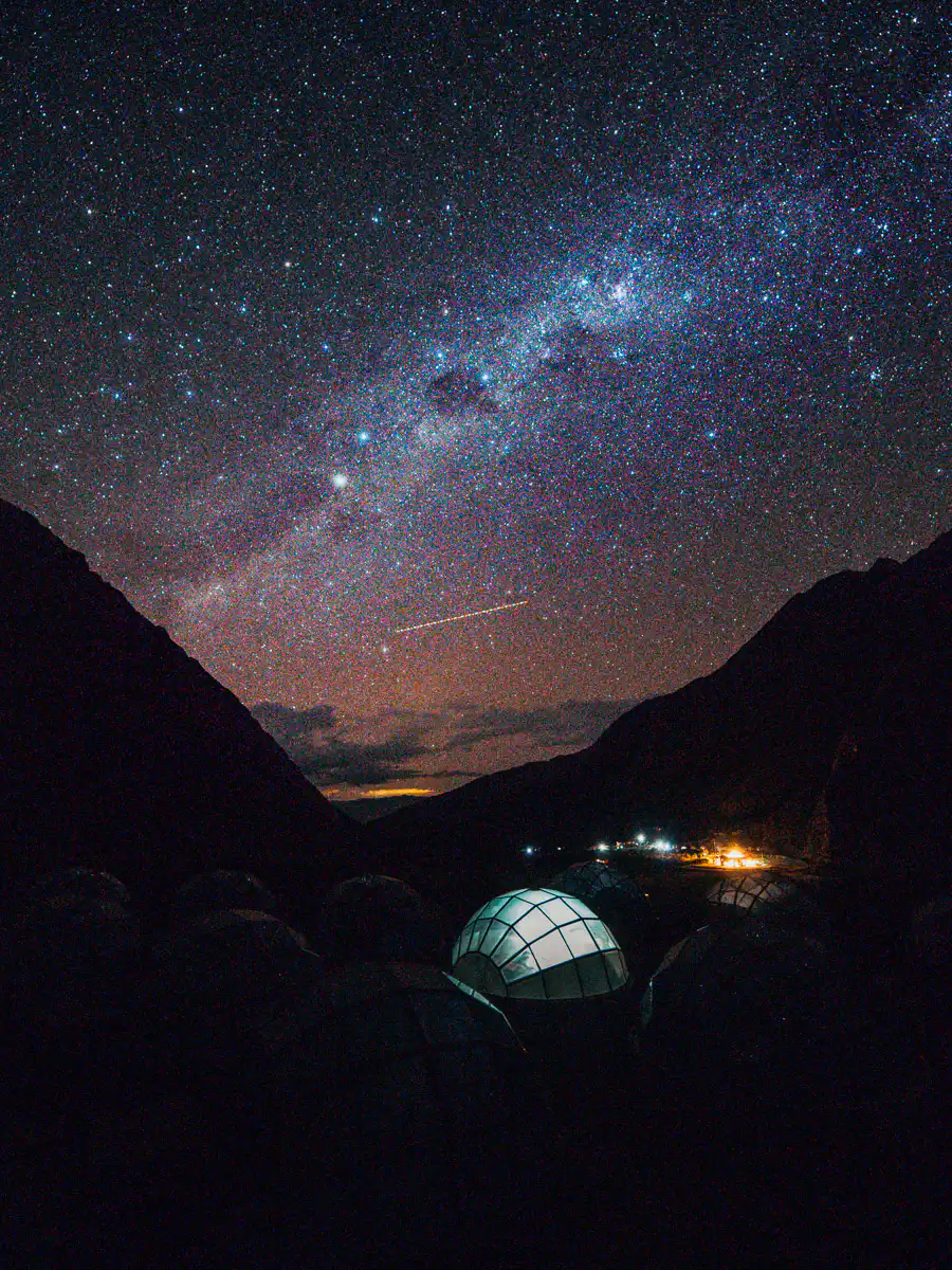 tent lit up at night with milky way during salkantay trail