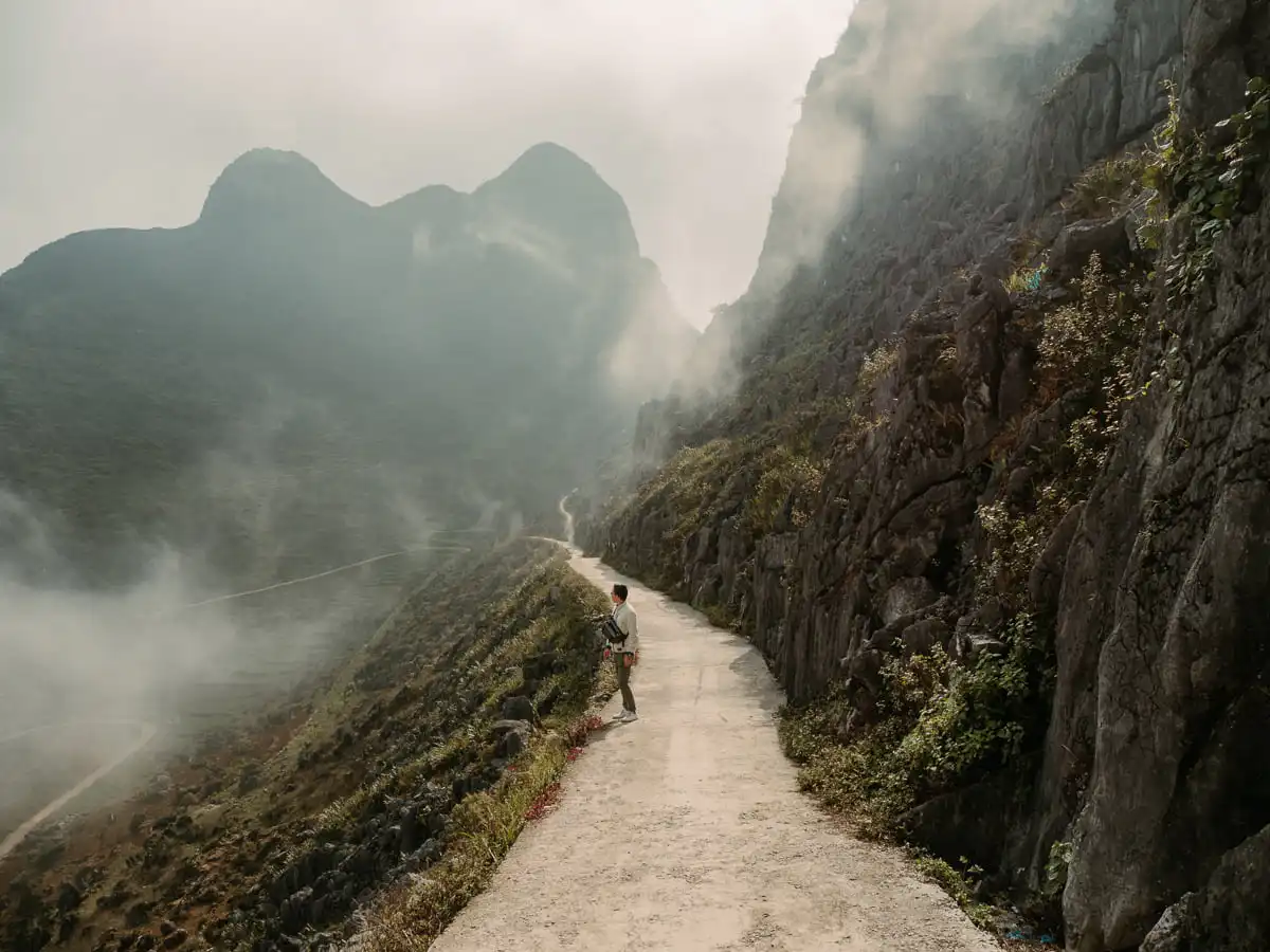 Ryan standing by the mist of the mountains of Ha Giang