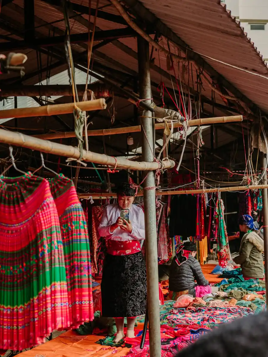 women selling colorful clothing at the market