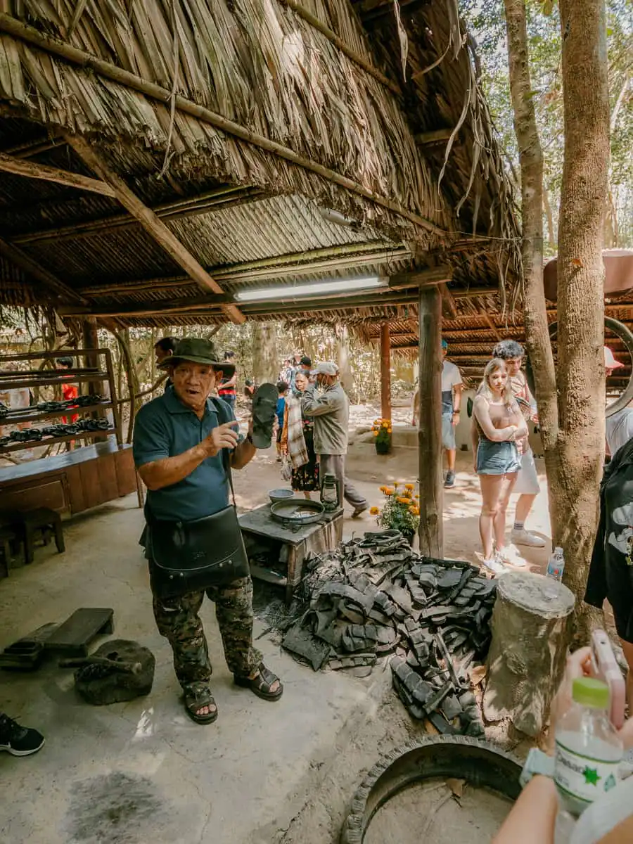 tour guide explaining the cu chi tunnels
