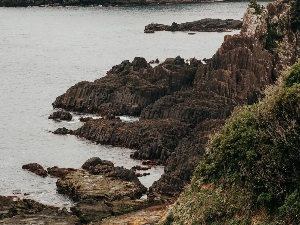 rocky black volcanic rock pillars in izu peninsula