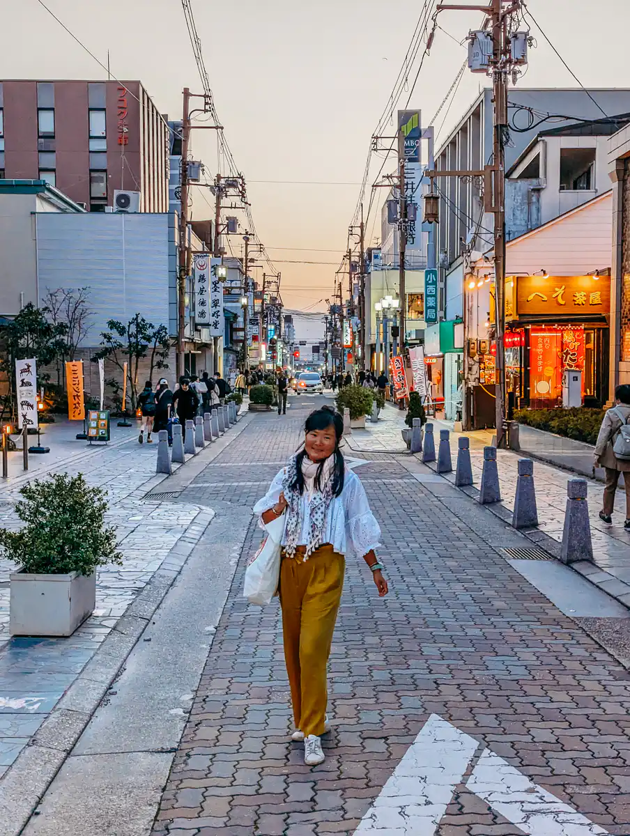 pretty street in Nara, woman standing there posing