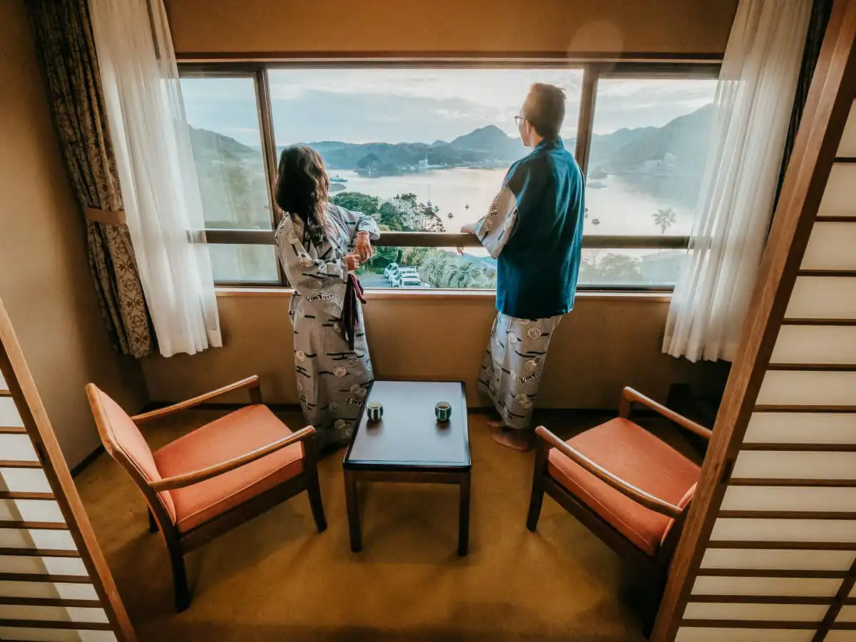 Two people standing in front of the window at the Ryokan in Japan