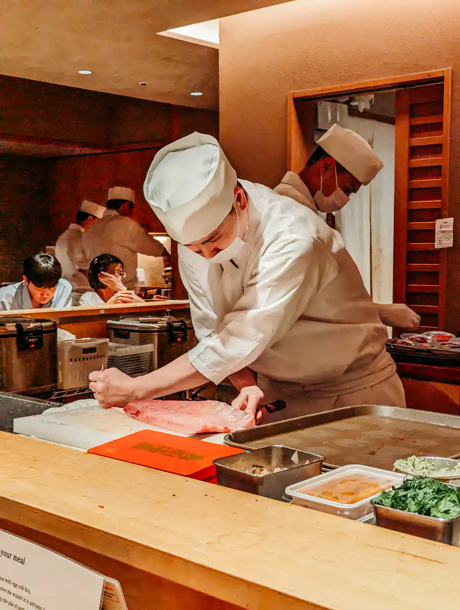 chef preparing fish in Japan