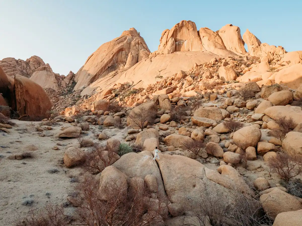 Spitzkoppe woman jumping over large boulder
