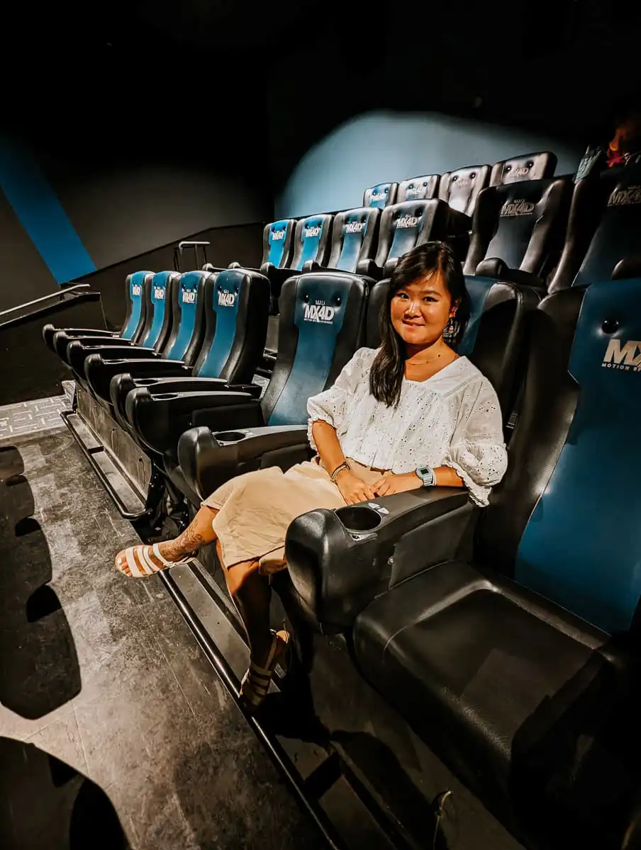 Woman sitting in Imax 4DX theatre in Tokyo