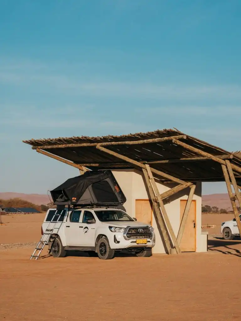 Car parked in front of the Sossusvlei Campsite