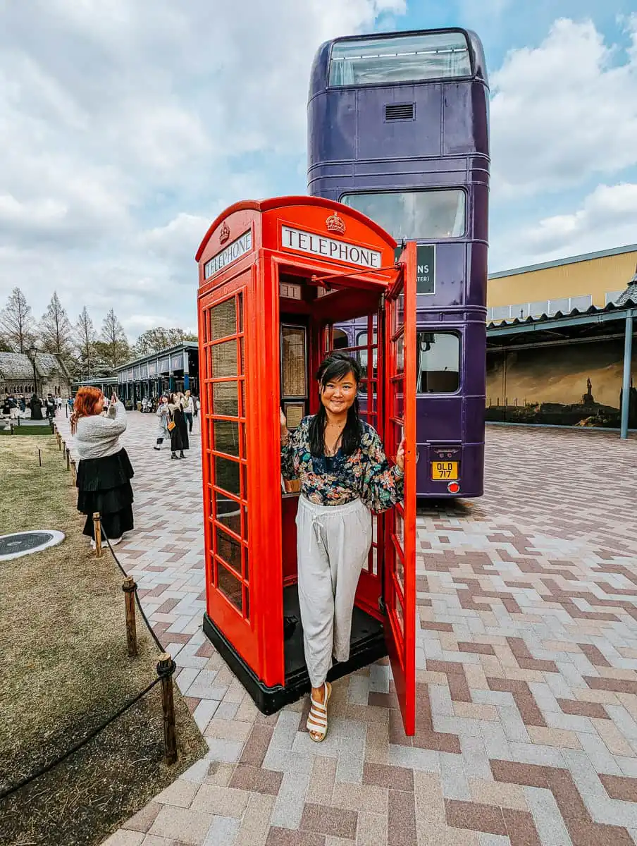 Walking out of the phone booth in harry potter studio tour