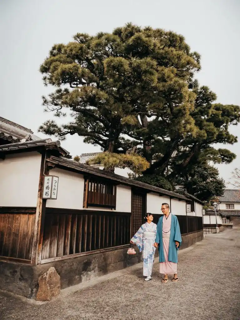 walking on the streets wearing kimonos