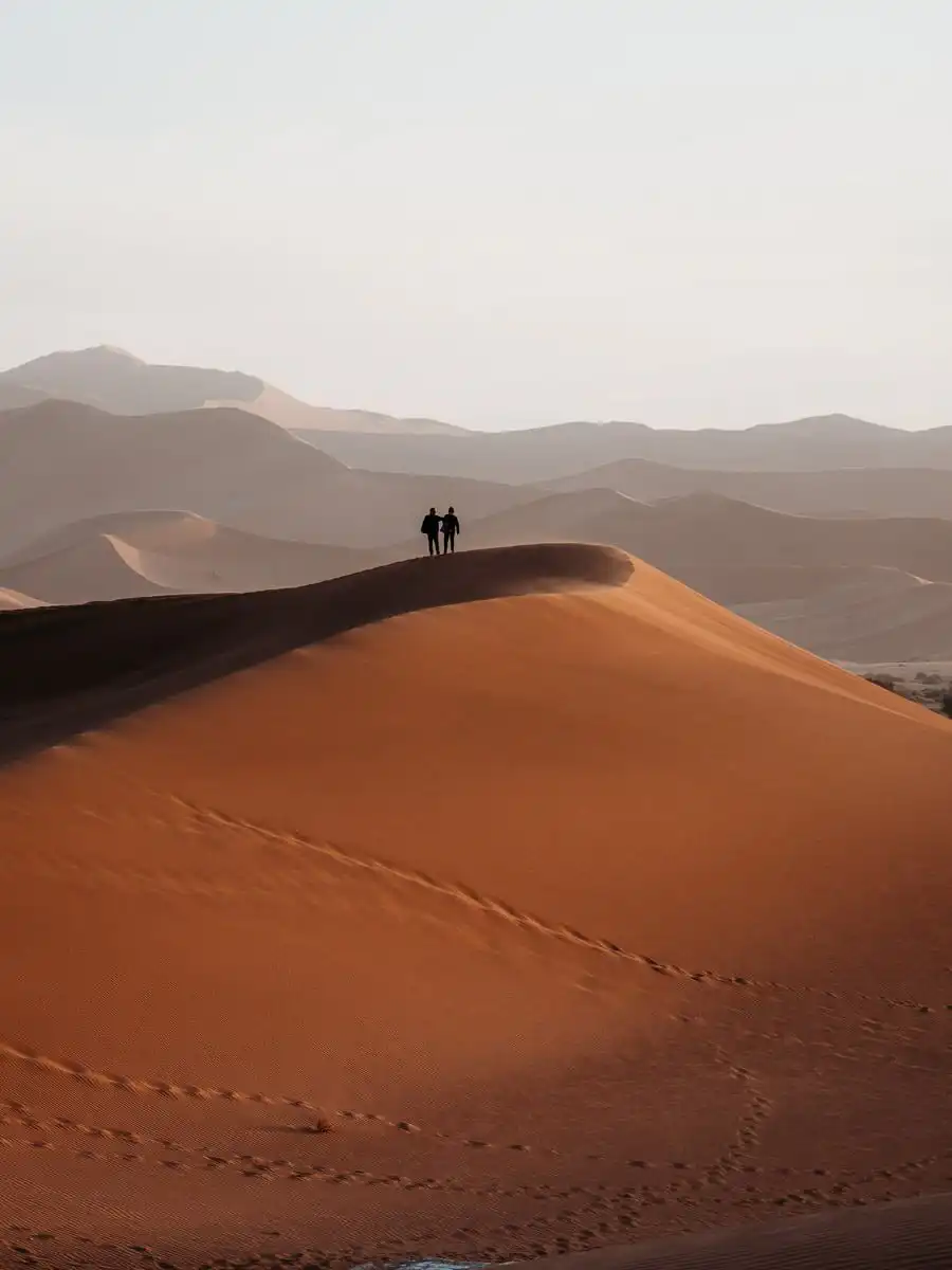 People climbing up Big Daddy Dune