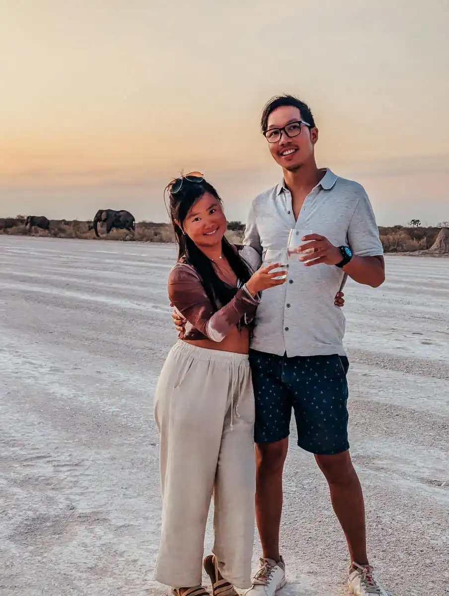 Us standing in front of a pack of elephants in Etosha