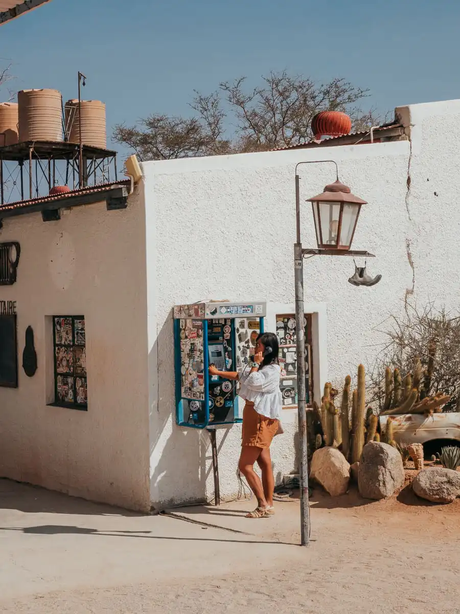 Using the phone booth at Solitaire in Namibia