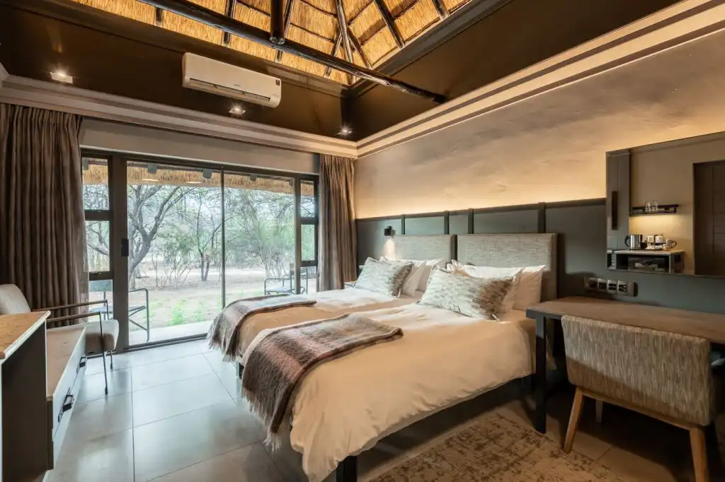 Bed at Mokuti Lodge