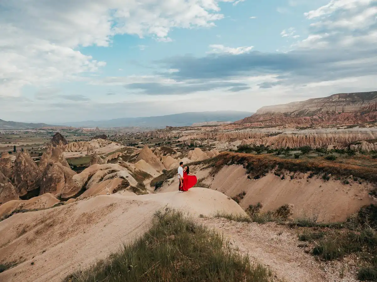 Man and woman standing in valley in Cappadocia, one of the most beautiful viewpoints on a 10 day Turkey Itinerary