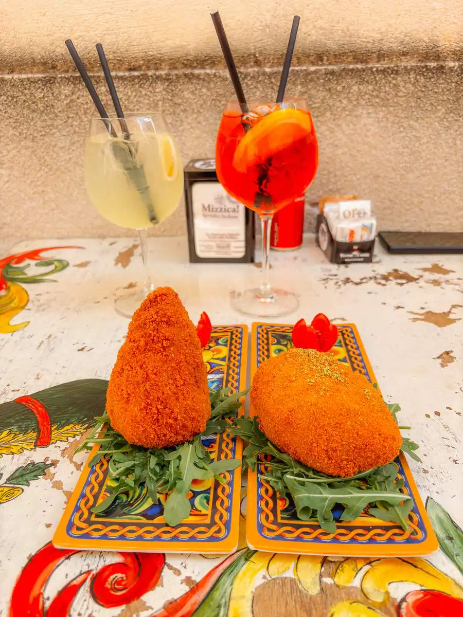Arancinis and aperol spritz