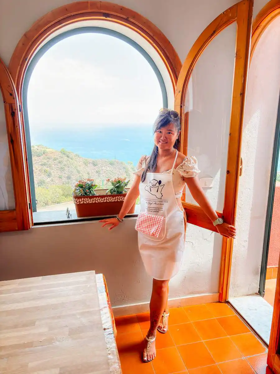 Standing next to window at cooking class in Taormina, best things to do in Taormina