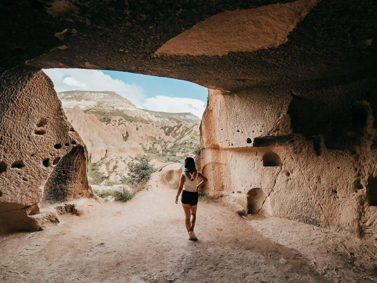 standing inside one of the cave rooms during our hike in red valley