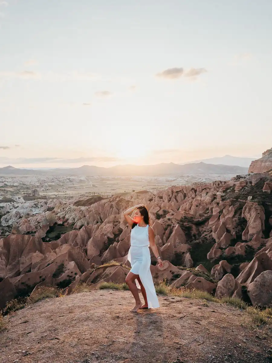 woman posing at sunset at panoramic viewpoint in Cappadocia