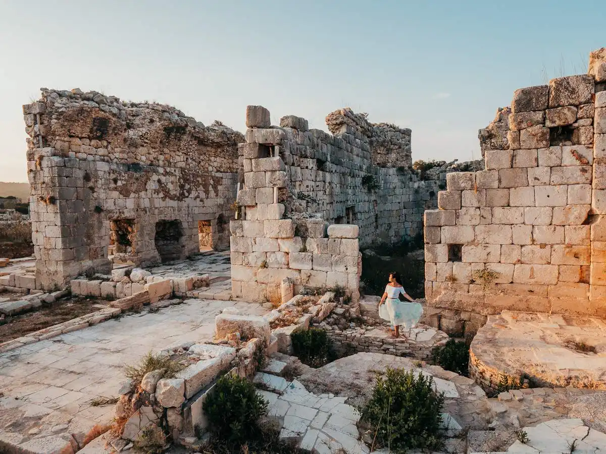 Woman standing in the Patara ruins, one of our favourite places during our 10 day Turkey Itinerary