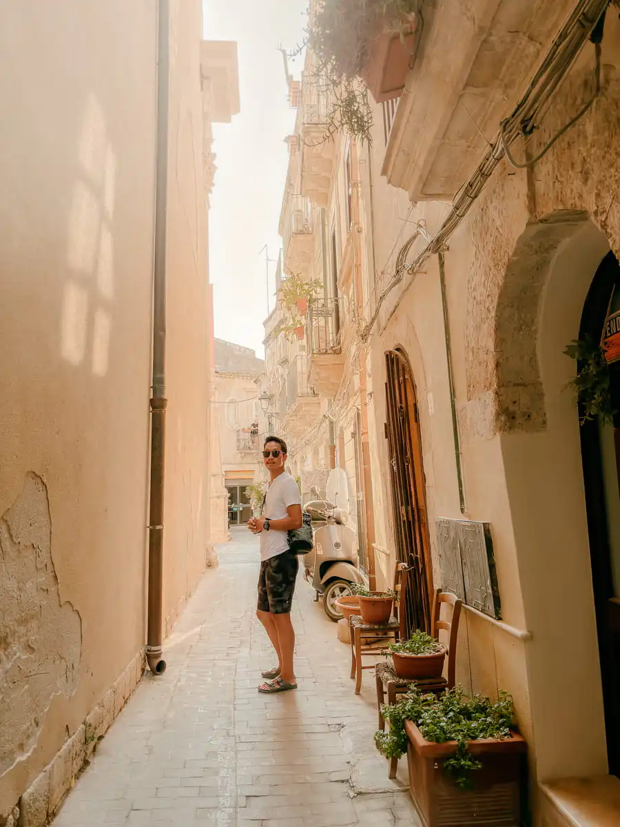 Standing in narrow street in Syracuse Sicily