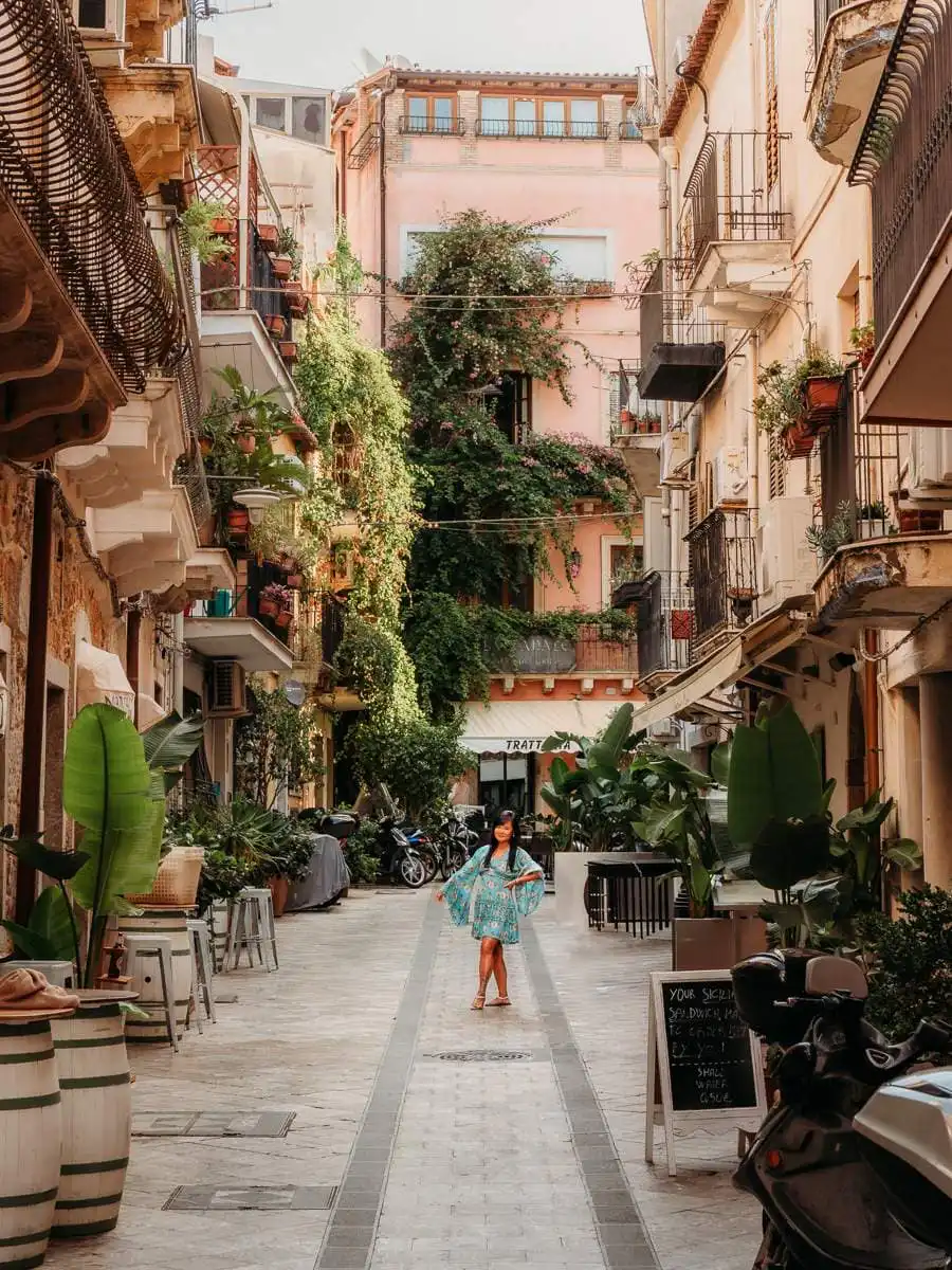 Woman standing in the narrow streets of Taormina
