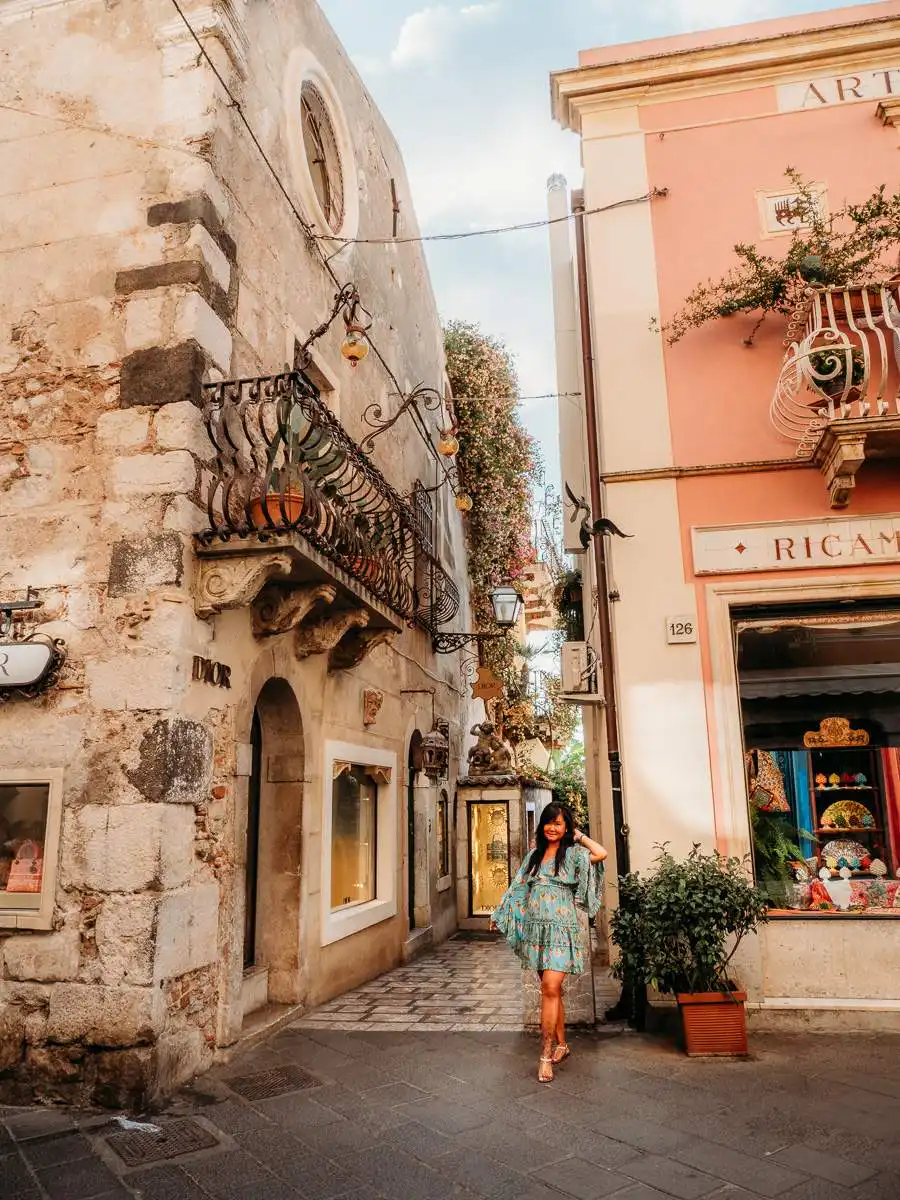 Standing in cute street in Taormina