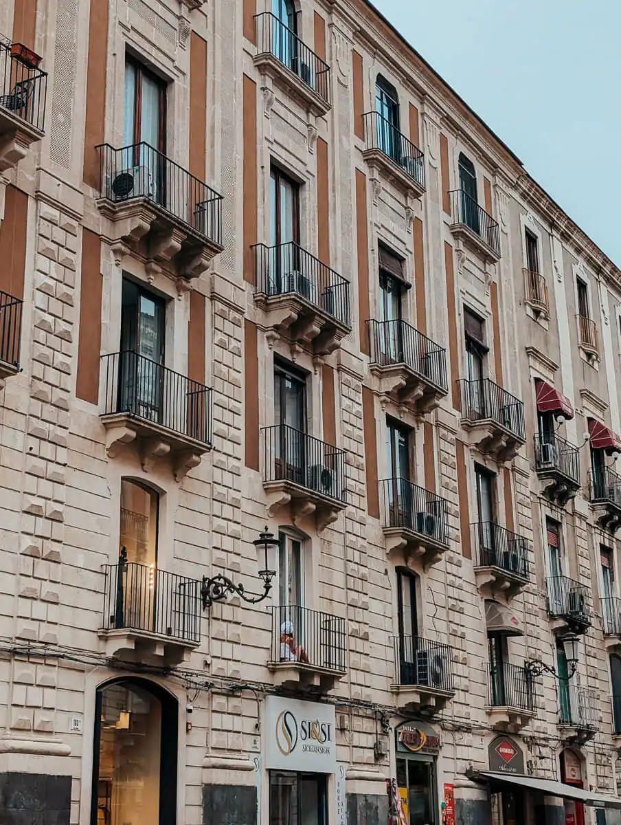 woman sitting in window in Catania