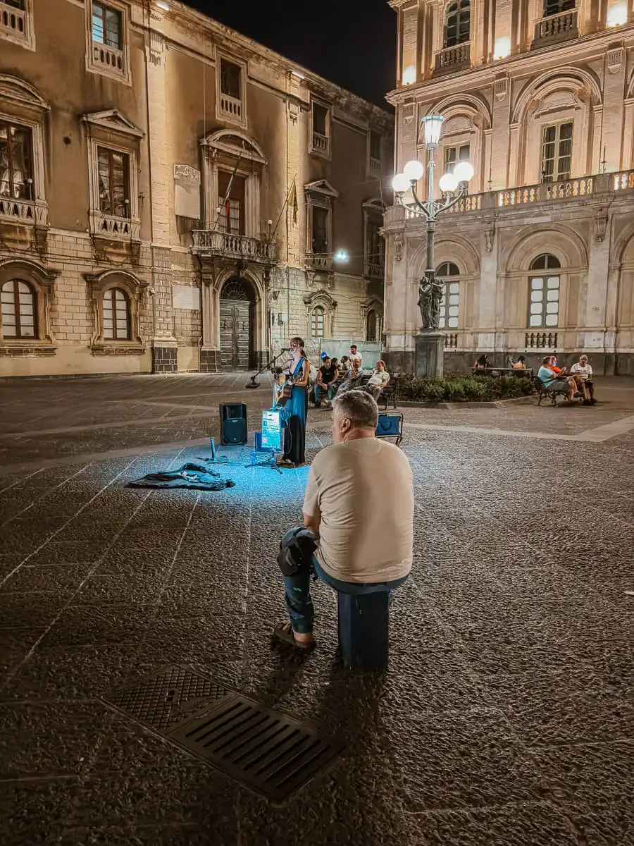 street performer at night in Catania