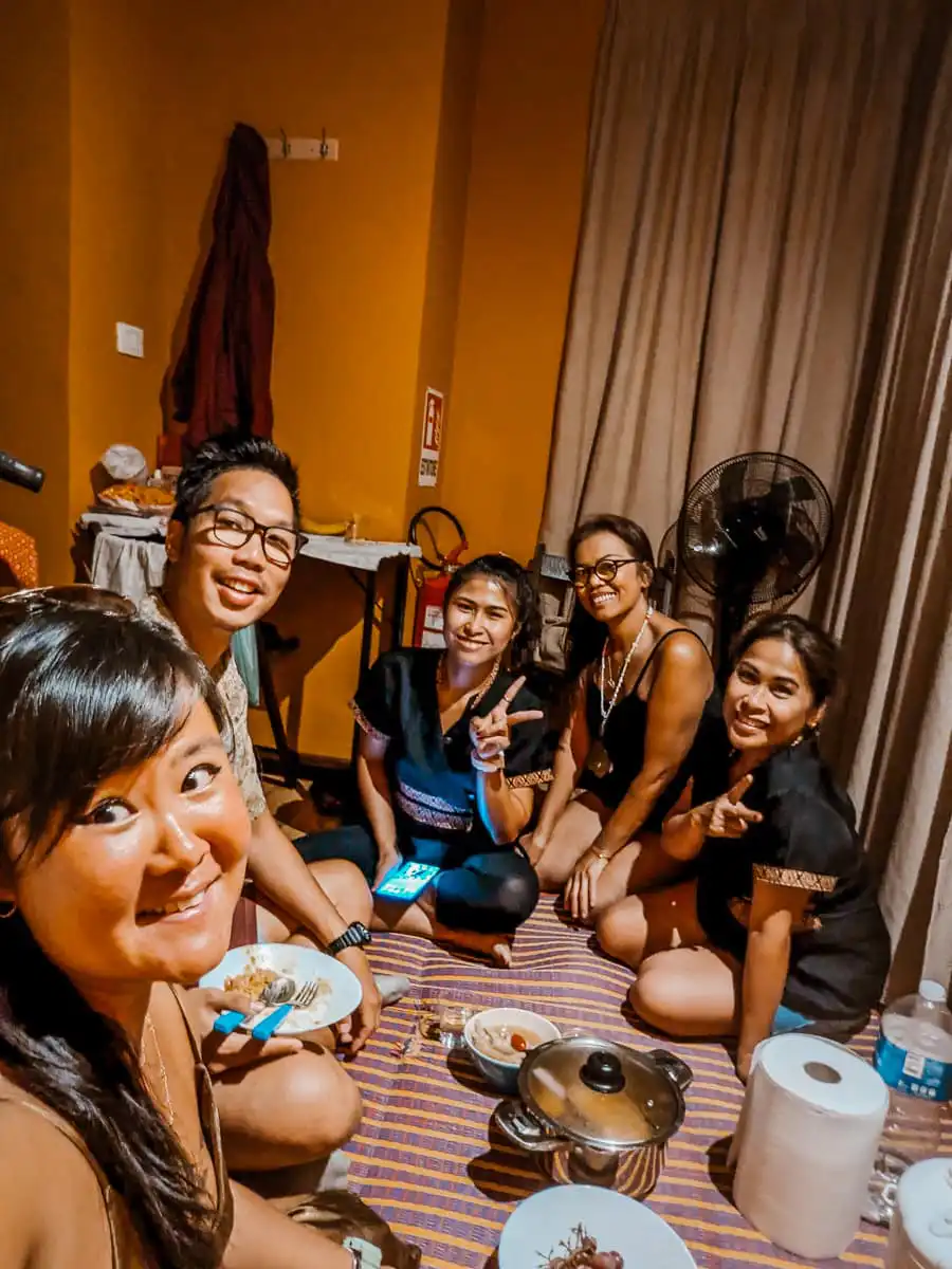 Sitting with Thai family eating lunch