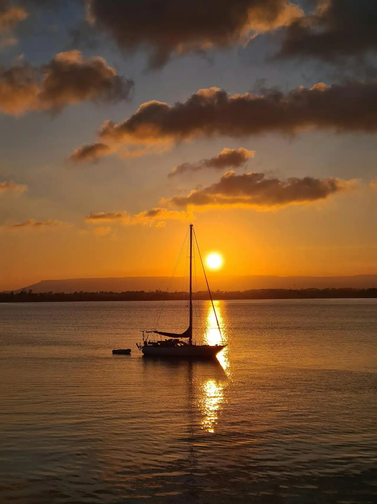 Sailboat at sunset in Sicily