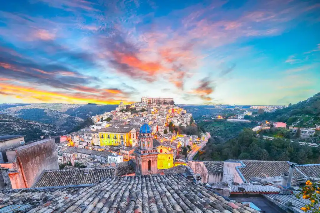 Ragusa at sunset with red and pink skies