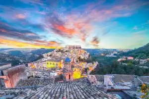 Ragusa at sunset with red and pink skies