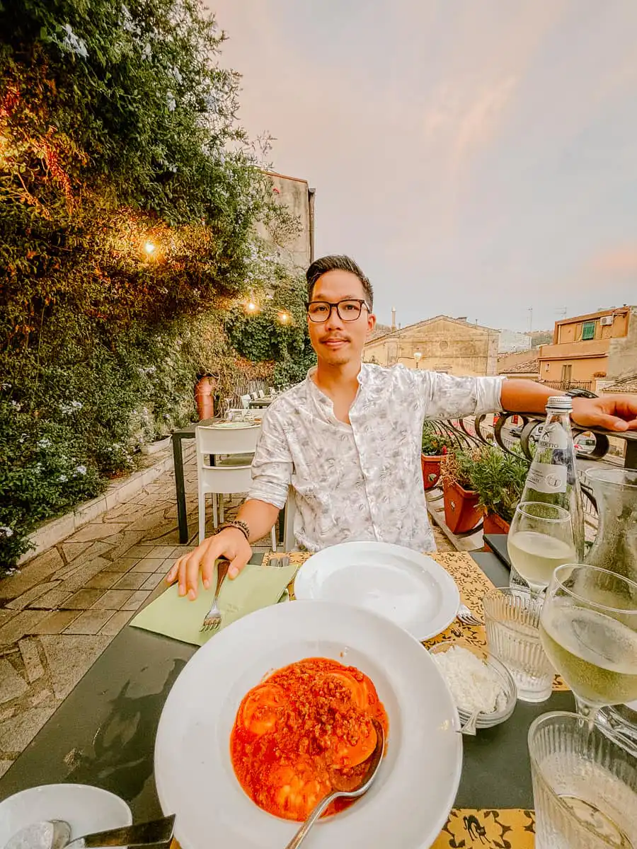 Ryan dining at the restaurant on a terrace
