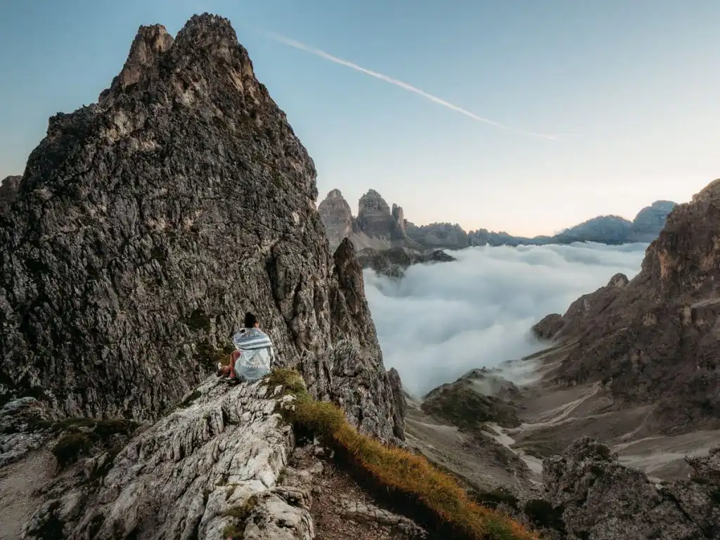 Sitting at the viewpoint next to rifugio fonda savio in the dolomites