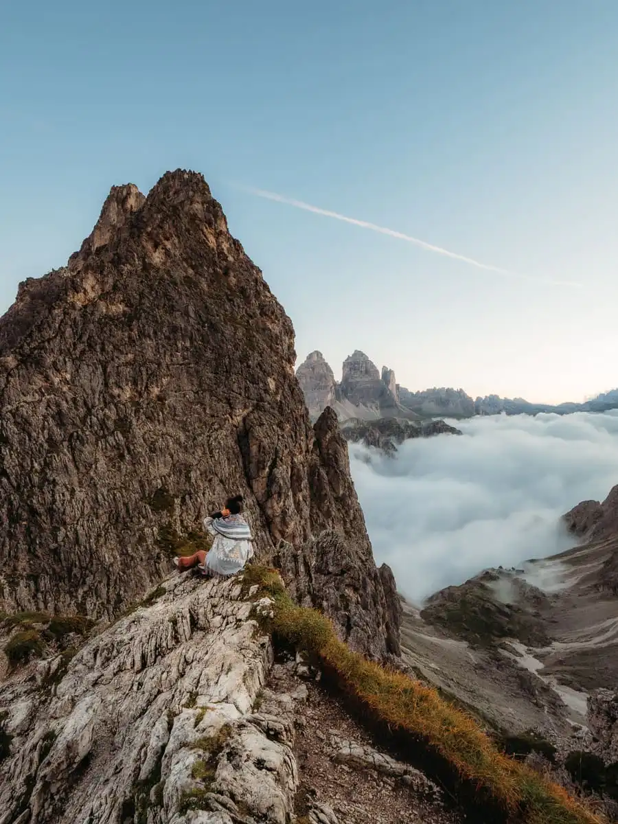 Sitting on top of rock at rifugio fonda savio