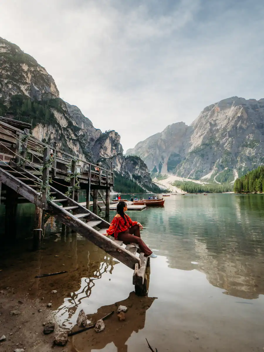 Lago di braies sitting next to the water