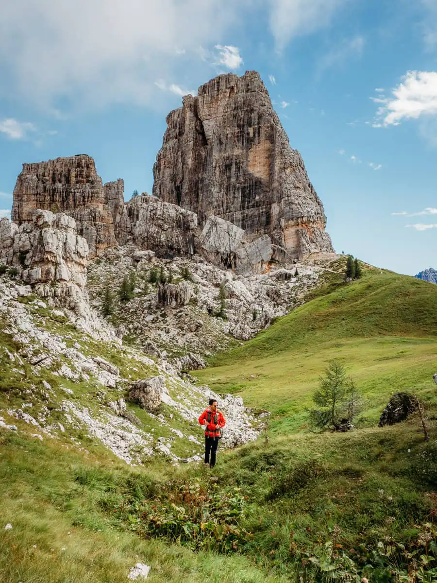 Cinque Torri pillars with man standing in front of pillars