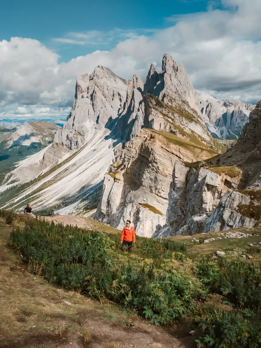Standing in the field in Seceda in front of the ridge line