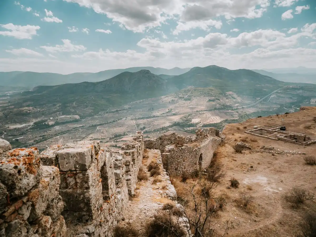 Standing on the wall of Acrocorinth fortress, one of the best things to do in Corinth