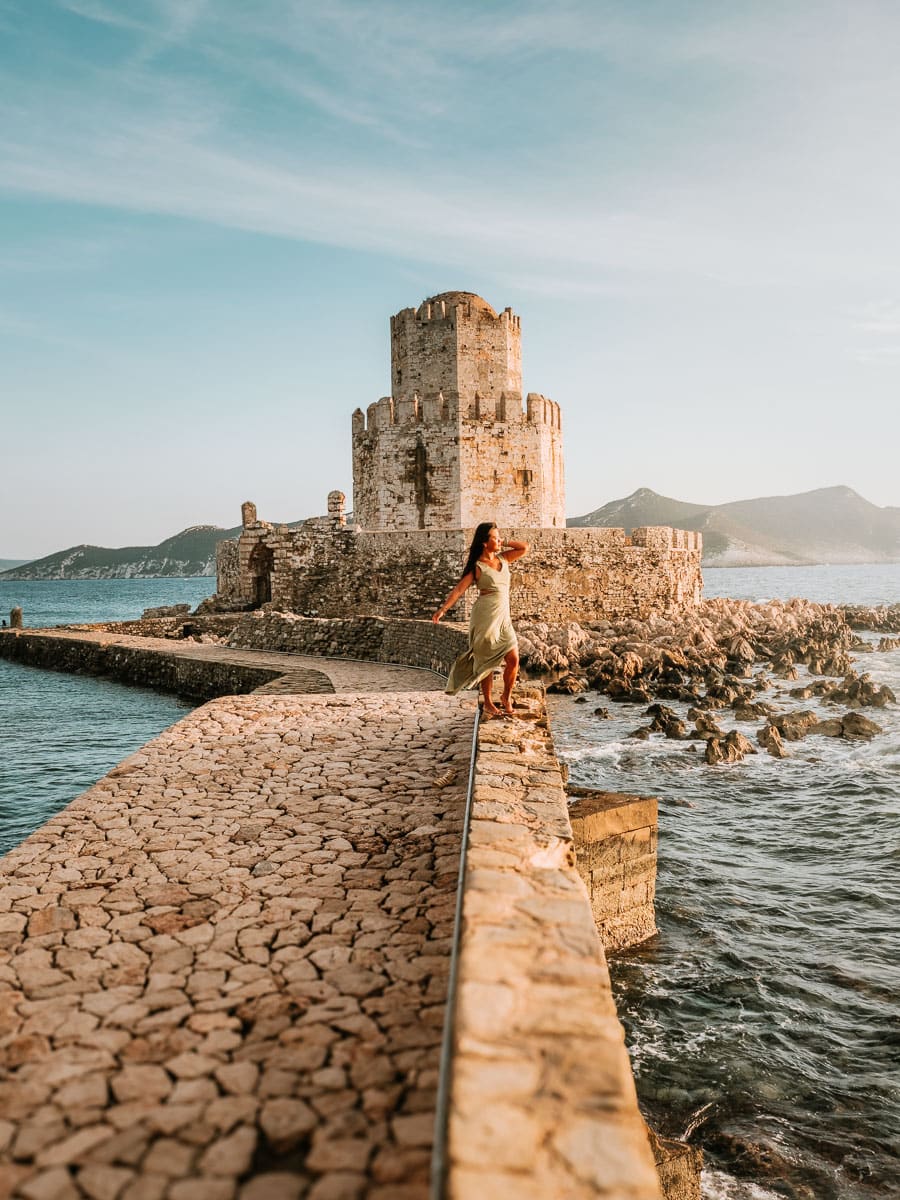Woman standing on the bridge leading to Methoni Castle