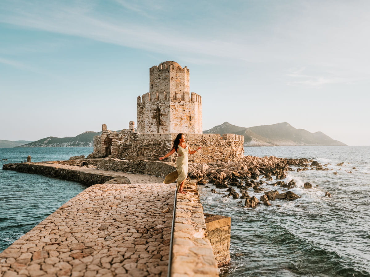 Standing and posing on the bridge leading to Methoni castle, one of our favourites on our Peloponnese road trip