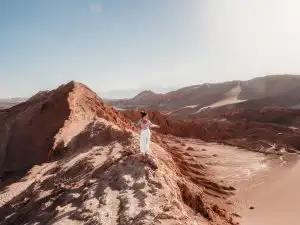 Standing at the dunes of Valle de la luna at sunset