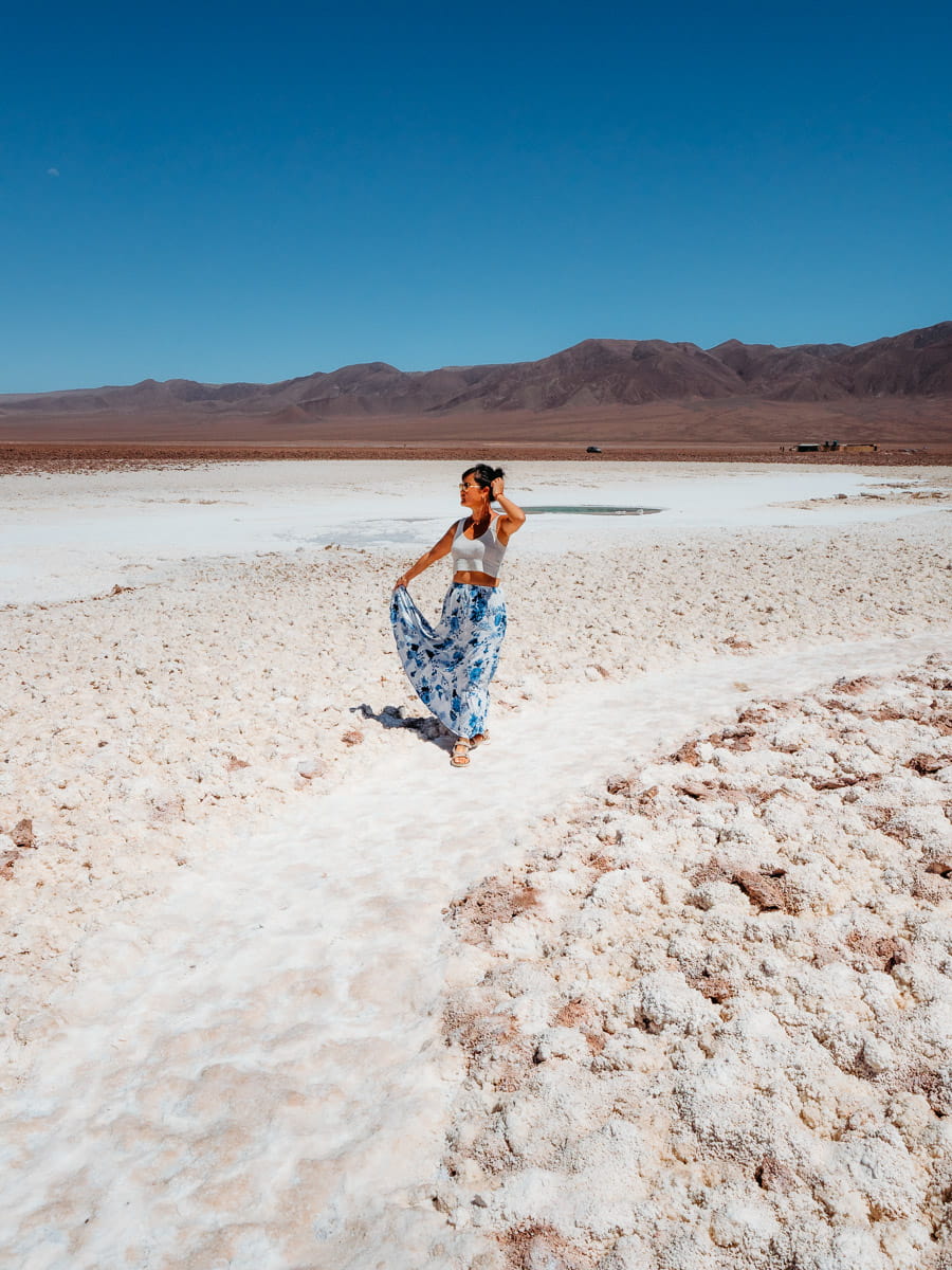 Walking along salt path in san pedro de atacama desert's laguna baltinache