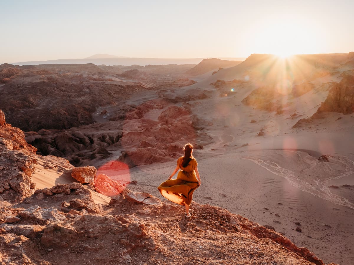 Watching the sunset, woman wearing orange dress