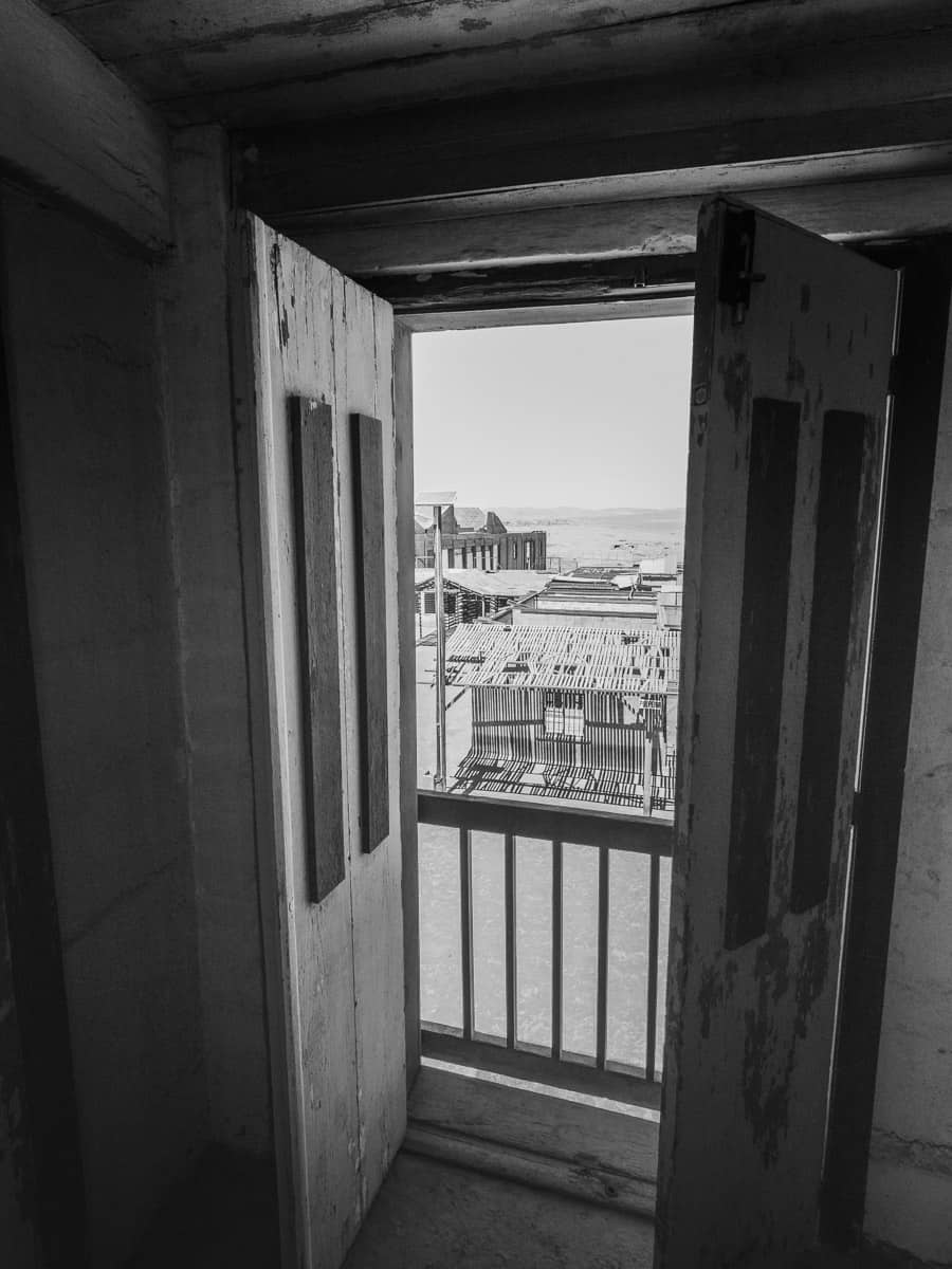 Doorway showing the abandoned town of Chacabuco